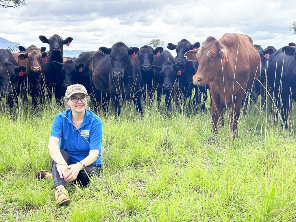 Dr. Rosangela Poletto with cows in pasture